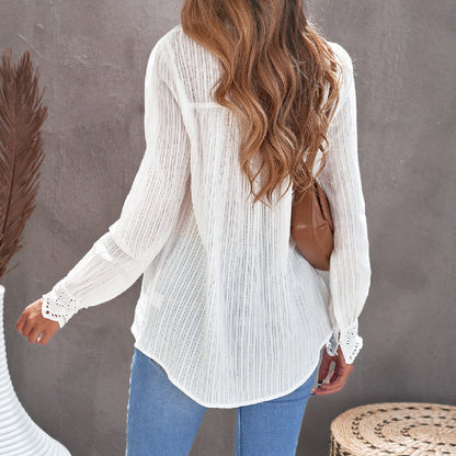 Elegant long-sleeved blouse with lace