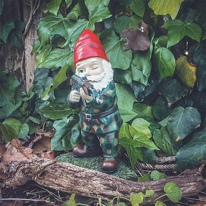 Garden gnome in camouflage with ak47