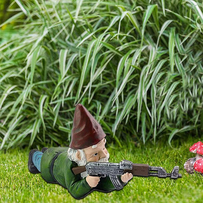 Garden gnome in camouflage with ak47