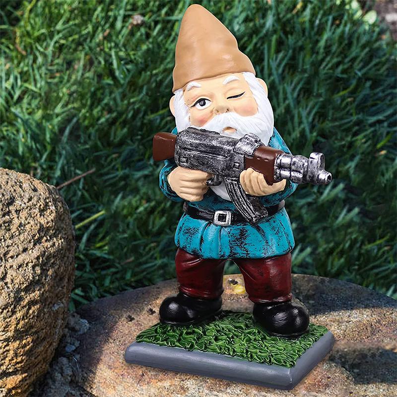 Garden gnome in camouflage with ak47