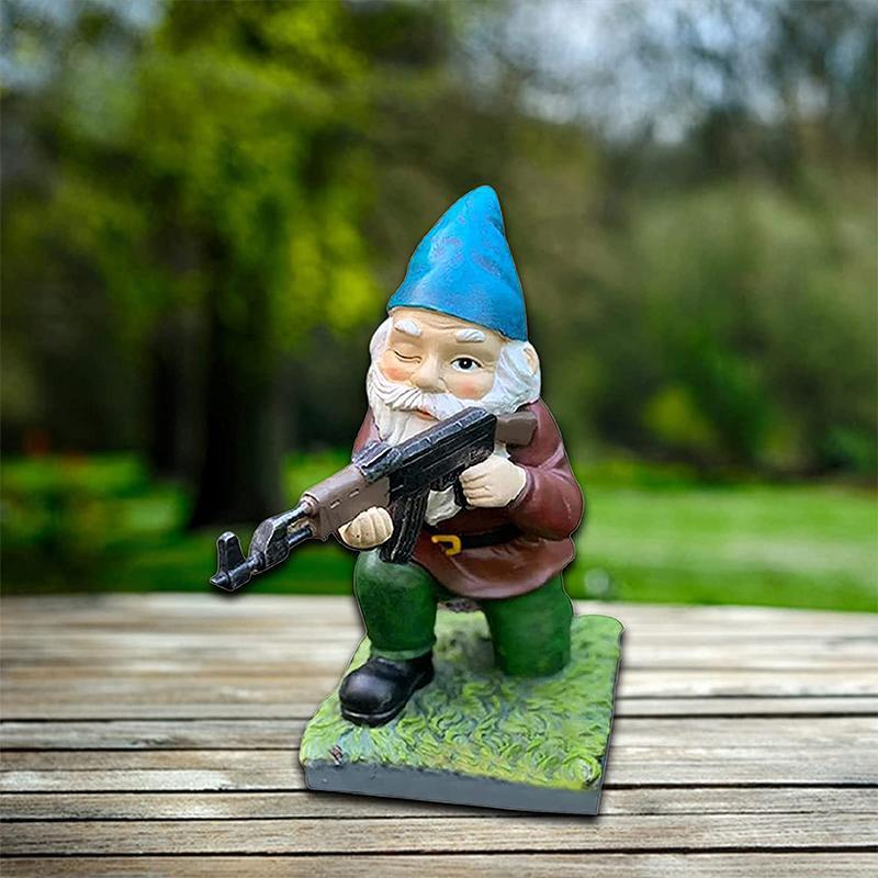 Garden gnome in camouflage with ak47