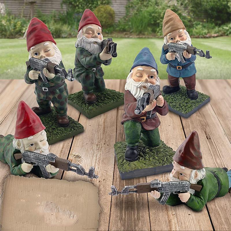 Garden gnome in camouflage with ak47