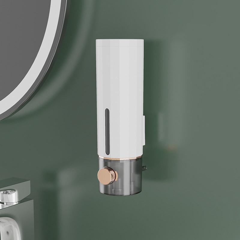 Manual soap dispenser for wall mounting