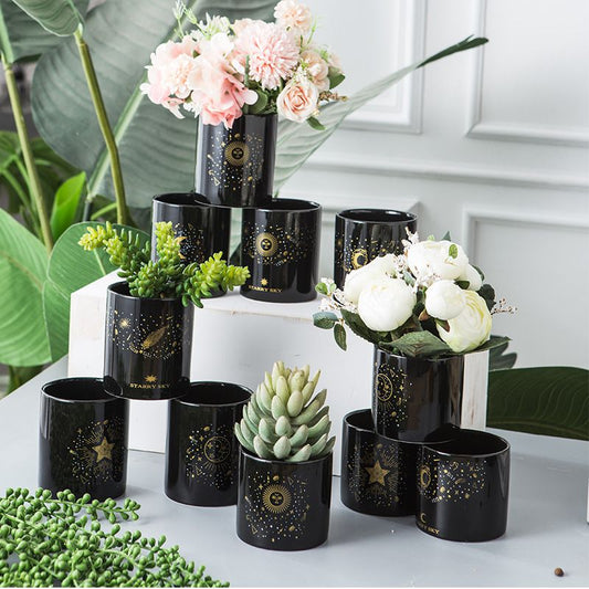 Black flower pots with gold decorations